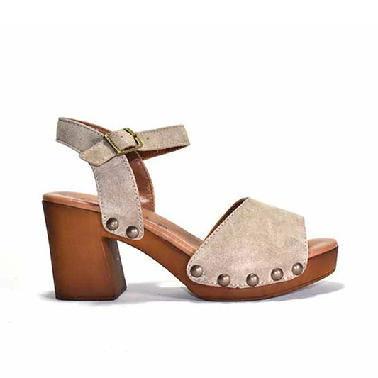 Beige suede sandal with wooden block heel on a white background