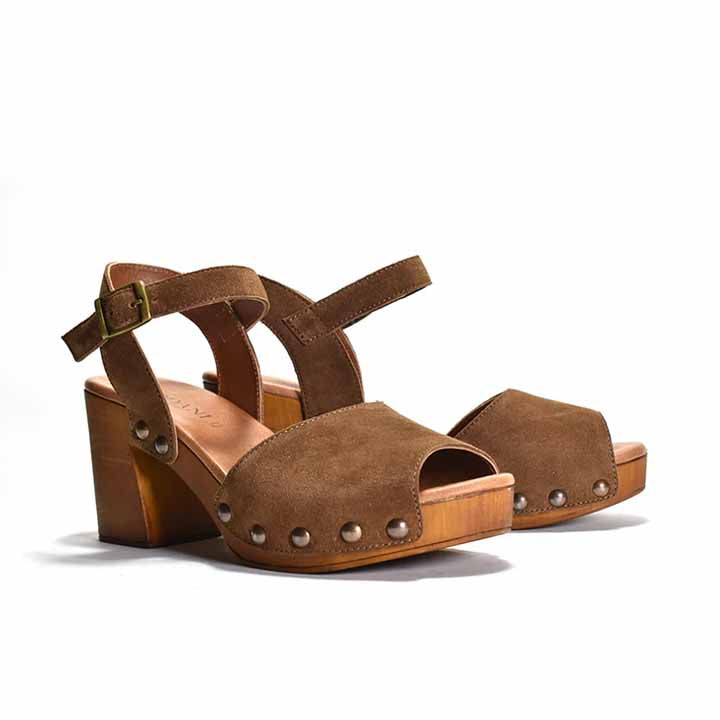 pair of Brown sandal with ankle strap and stud detail, on a wood-like platform heel.