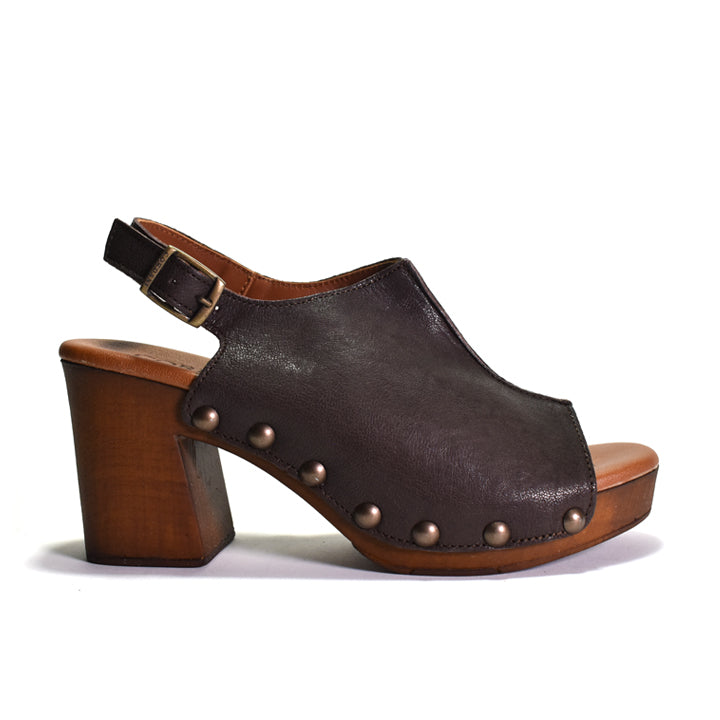 A dark brown leather slingback clog sandal with a chunky wooden block heel, studded upper, and open toe, shown from a side profile on a white background.