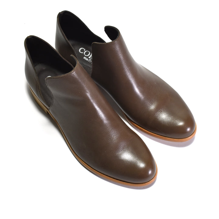A pair of dark brown leather with open sides, displayed on a clean white background.