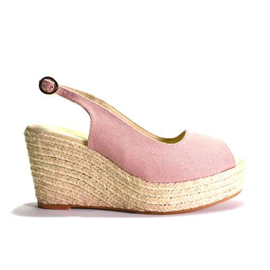 Pink wedge sandal with jute sole on a white background