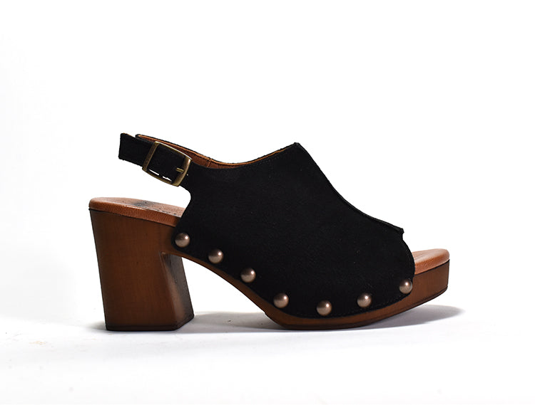 A black peep-toe slingback heel with stud detail on a wood-like platform, with an adjustable buckle