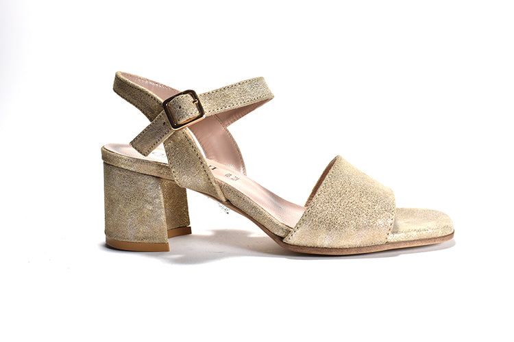 Shimmery sandal with a wrapped block heel, adjustable metal buckle, and a leather lining.