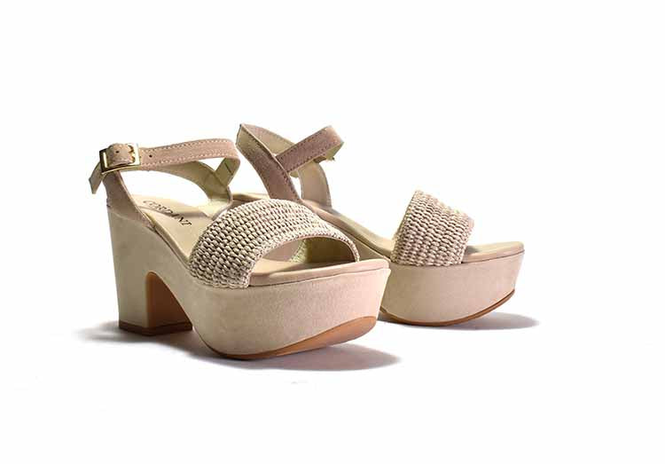 pair of white platform sandals with a woven fabric and suede upper, featuring a suede wrapped heel and an adjustable metal buckle.