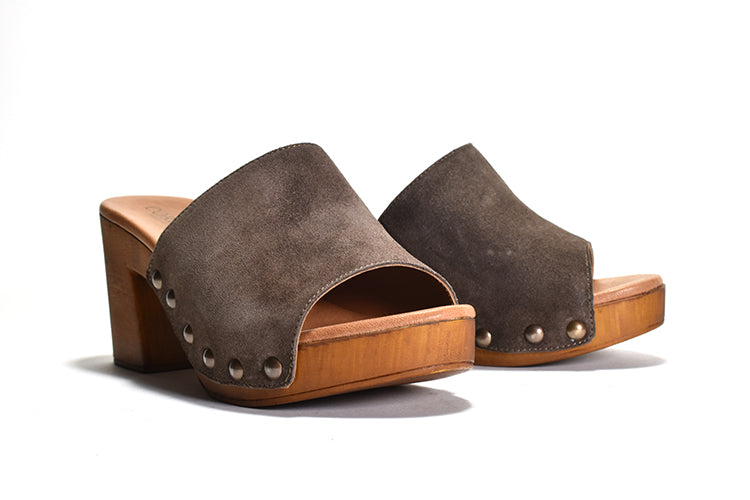 pair of grey suede Slip on sandal with stud detail on wood-like platform