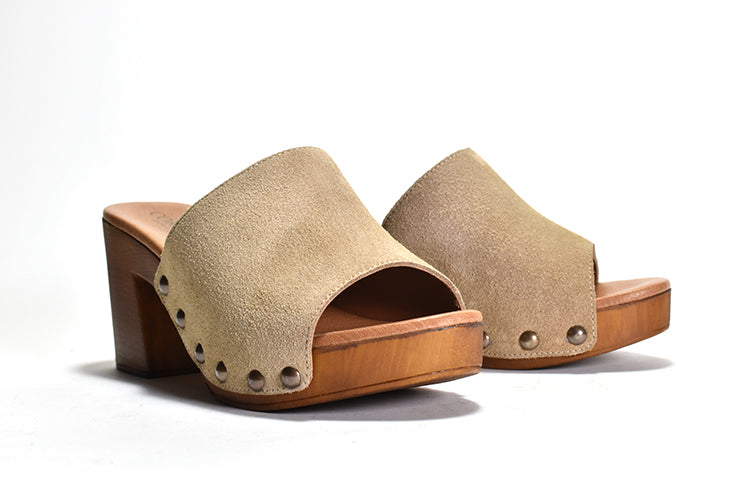pair of white suede Slip on sandal with stud detail on wood-like platform
